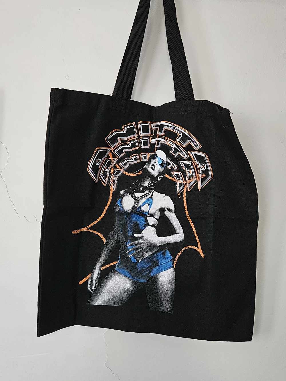 Anitta Black Graphic Tote Bag with Blue & Orange Print.